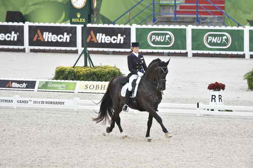 WEG-Dressage-8-25-14-GPTeam-0003944-TinaKonyot-CalectoV-USA-DDeRosaPhoto